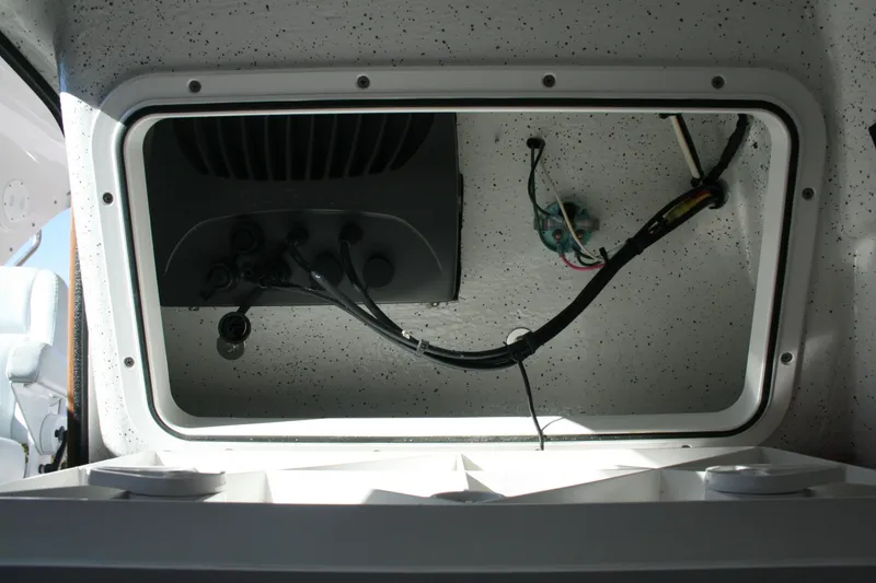 Slide: The Image of Interior of 2012 Protector Targa 30 boat with cushioned seating and cabin door. - 12