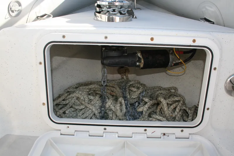 Slide: The Image of Interior of 2012 Protector Targa 30 boat featuring a compact marine toilet. - 14