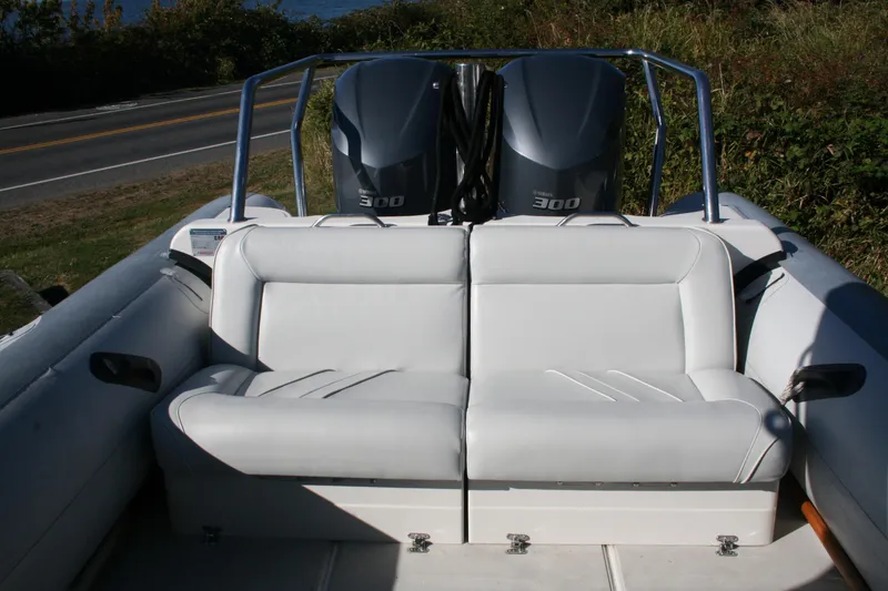 Slide: The Image of 2012 Protector Targa 30 boat interior with Yamaha engines and cushioned seating. - 19