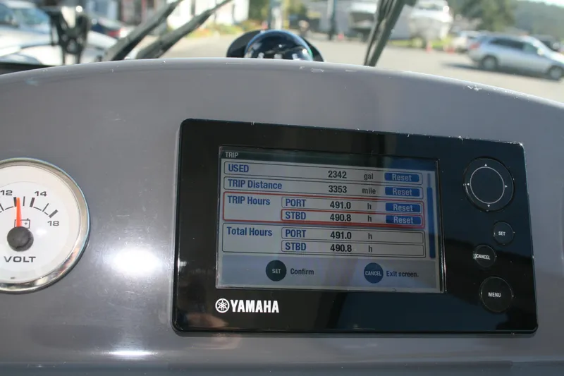 Slide: The Image of 2012 Protector Targa 30 boat dashboard with Garmin navigation and Yamaha controls. - 6