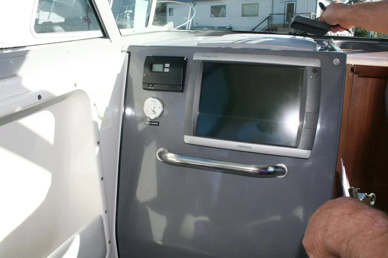 Slide: The Image of Dashboard of a 2012 Protector Targa 30 boat with Yamaha display and voltmeter. - 7