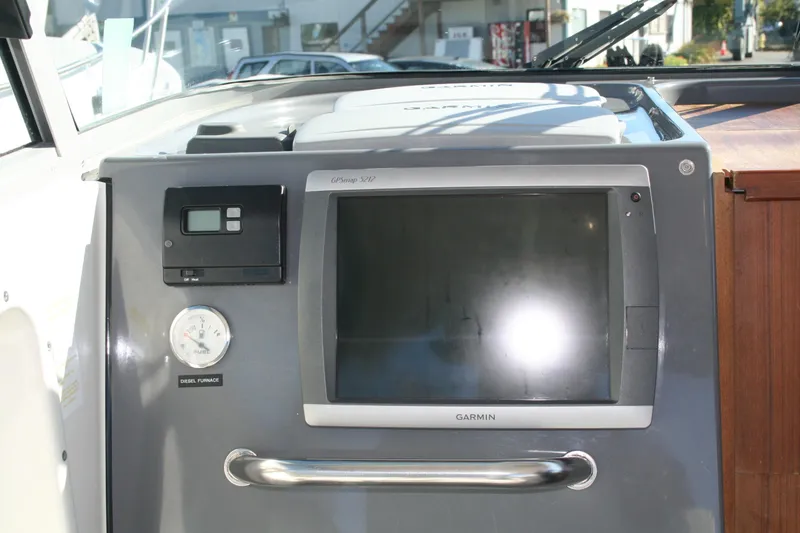 Slide: The Image of Control panel of a 2012 Protector Targa 30 boat with Garmin display. - 8