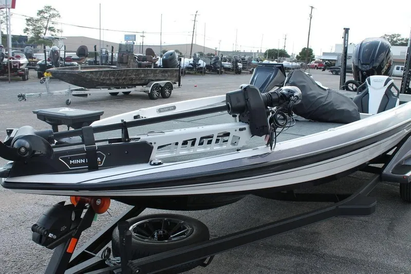 Slide: The Image of 2026 Skeeter FXR21 FLEX boat deck with carpeted surface and equipment. - 4