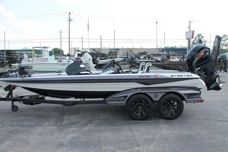 Slide: The Image of 2026 Skeeter FXR21 FLEX boat logo on metallic surface. - 7