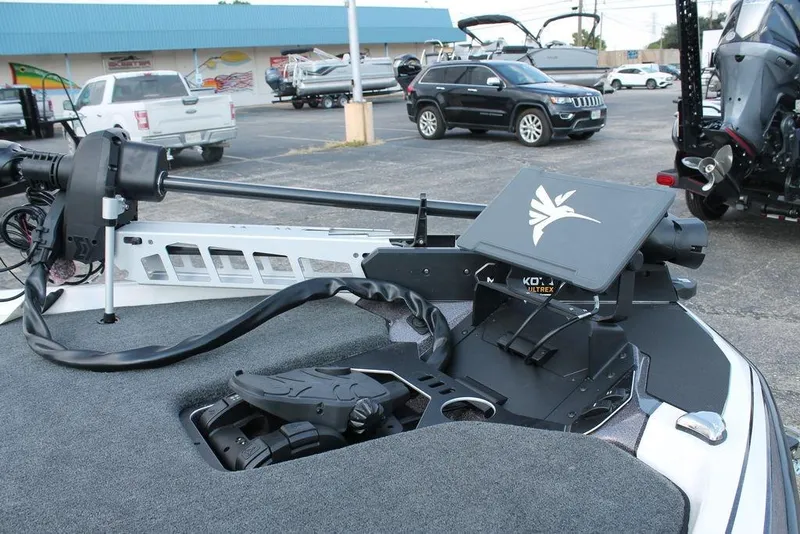 Slide: The Image of 2026 Skeeter FXR21 FLEX boat with Yamaha engine on trailer, parked outdoors. - 8