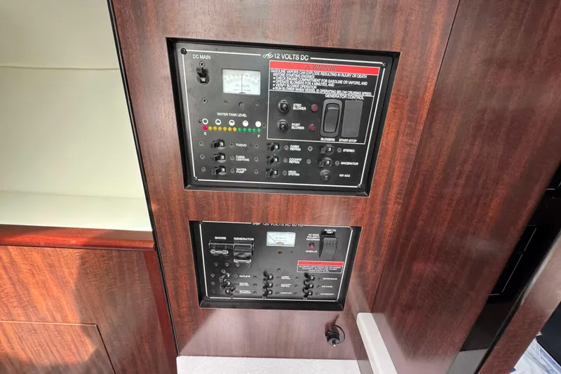Slide: The Image of Control panel of 2019 Monterey 295 Sport Yacht with wood finish. - 20