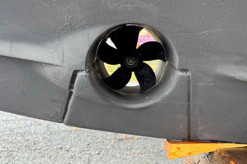 Slide: The Image of Close-up of a 2019 Monterey 295 Sport Yacht's bow thruster on a wooden support. - 26