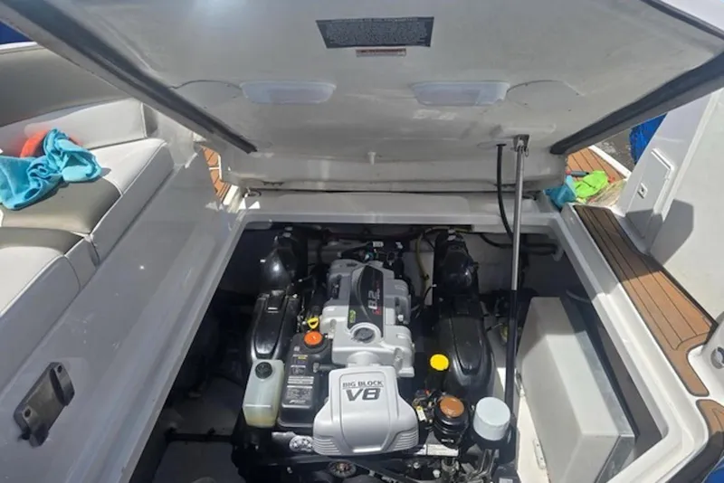 Slide: The Image of Engine compartment of a 2019 Monterey 295 Sport Yacht, showcasing a powerful V8 engine. - 32