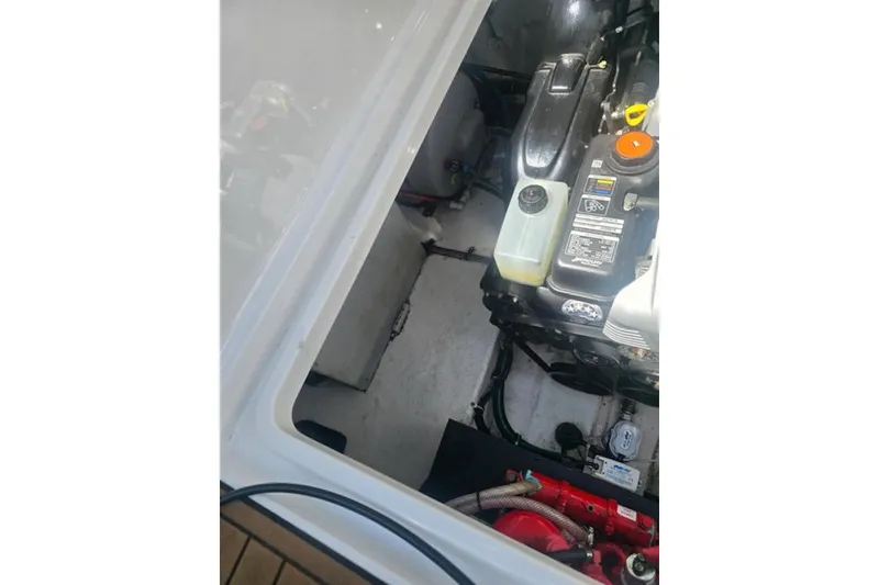 Slide: The Image of Engine compartment of a 2019 Monterey 295 Sport Yacht, showcasing mechanical components. - 33