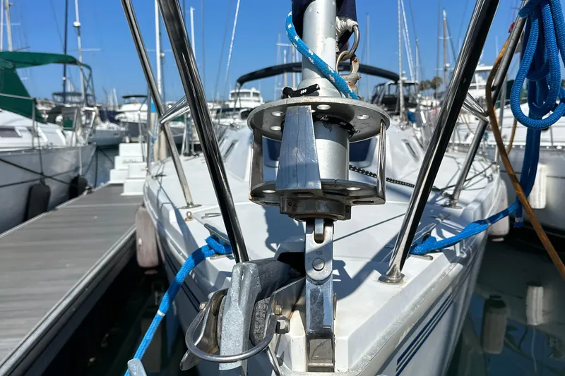 Slide: The Image of Close-up of a 1995 Catalina 320 sailboat docked at a marina. - 26