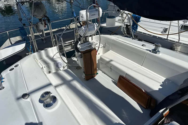 Slide: The Image of Cockpit of a 1995 Catalina 320 sailboat with steering wheel and seating. - 32