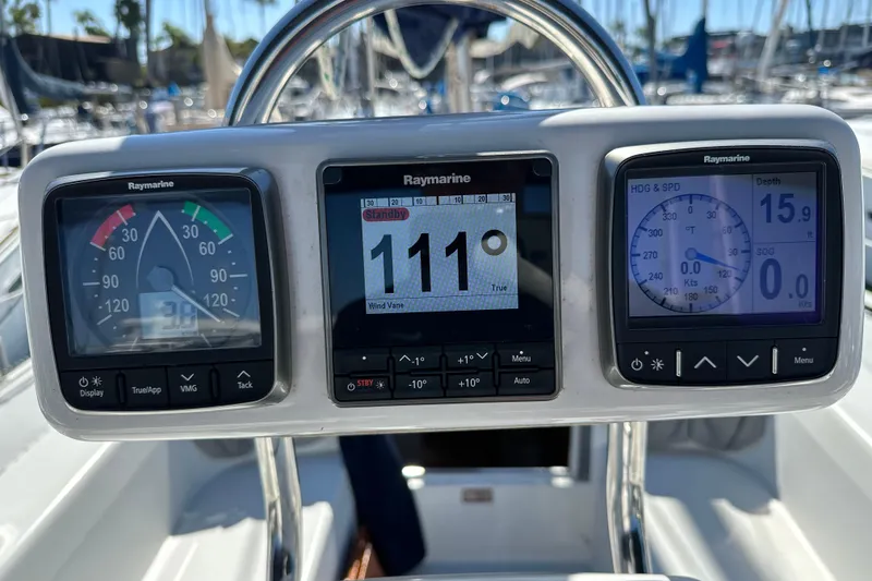 Slide: The Image of Cockpit instruments on a 1995 Catalina 320 sailboat, displaying navigation and depth data. - 39