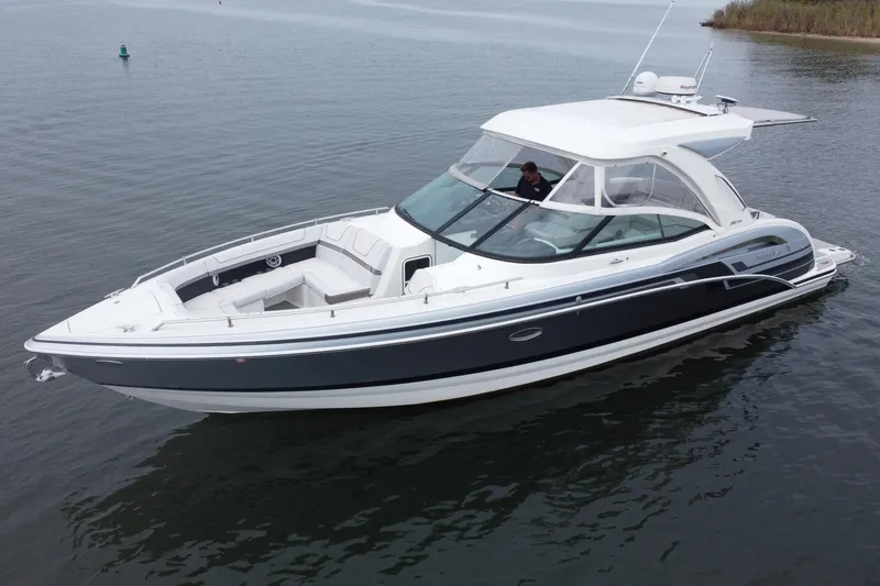 The Image of 2020 Formula 350 Crossover Bowrider on calm water, showcasing sleek design and spacious seating. - 0