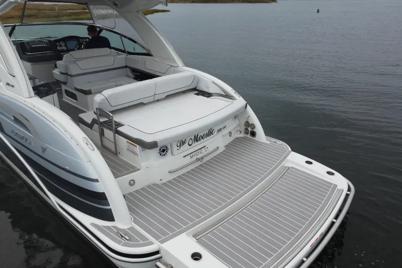 Slide: The Image of 2020 Formula 350 Crossover Bowrider on water, featuring spacious deck and seating. - 12