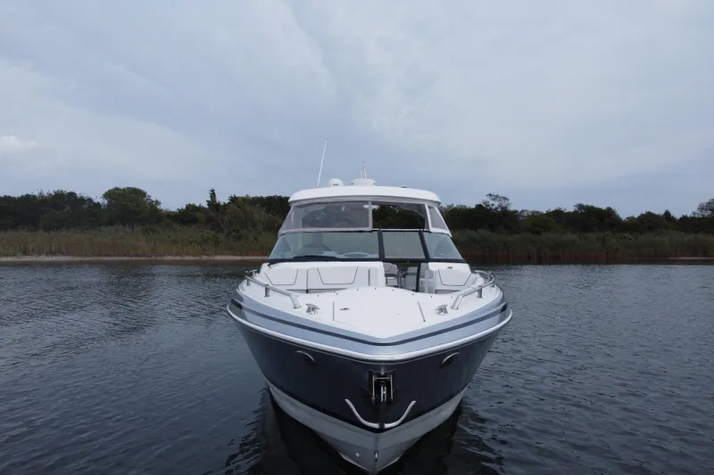 Slide: The Image of 2020 Formula 350 Crossover Bowrider on calm water, front view. - 13