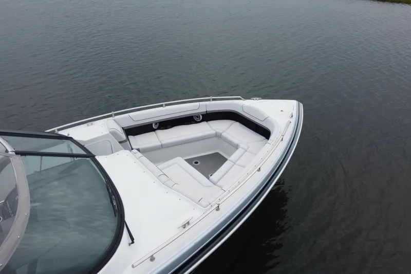 Slide: The Image of 2020 Formula 350 Crossover Bowrider on calm water, showcasing spacious seating area. - 15