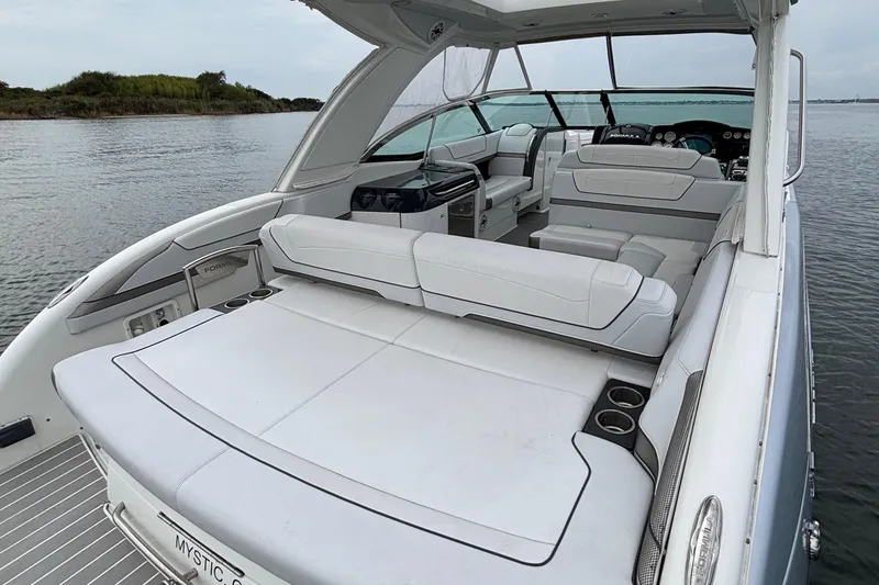 Slide: The Image of 2020 Formula 350 Crossover Bowrider with spacious seating on calm water. - 21