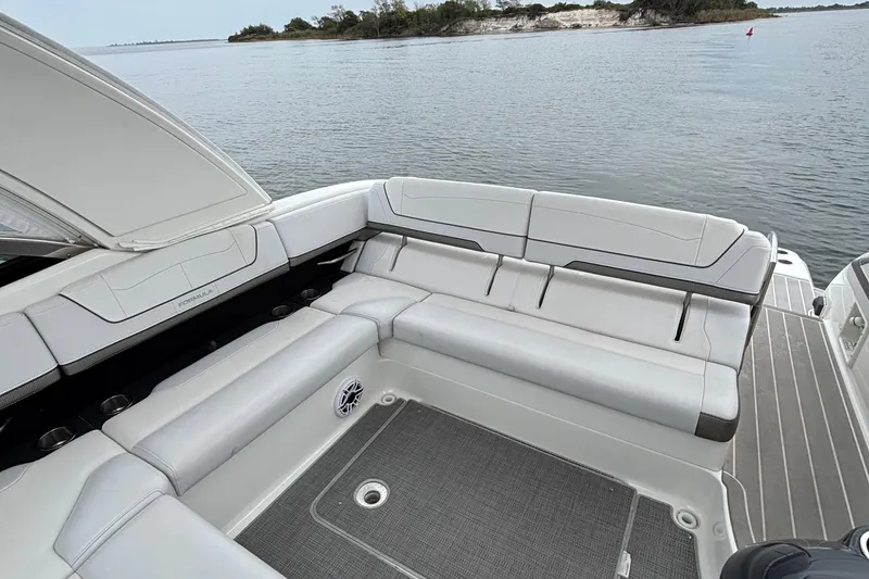 Slide: The Image of 2020 Formula 350 Crossover Bowrider interior with spacious seating, overlooking serene water. - 24