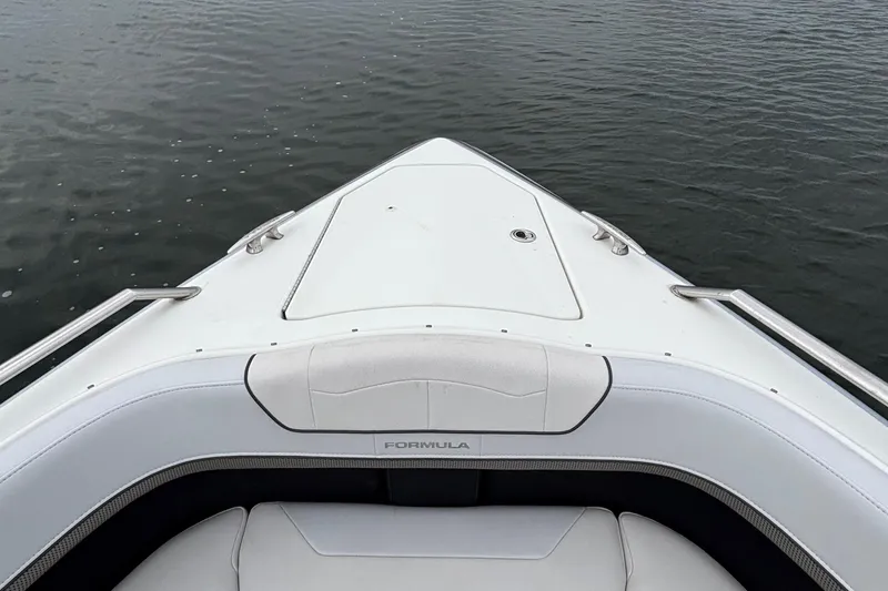 Slide: The Image of 2020 Formula 350 Crossover Bowrider on calm water, showcasing sleek design and luxury. - 30