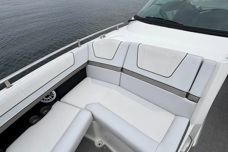Slide: The Image of 2020 Formula 350 Crossover Bowrider interior with white seating, overlooking calm water. - 32