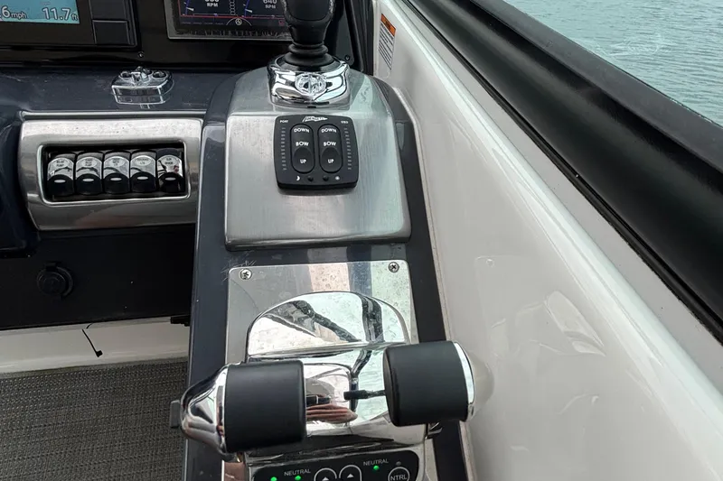 Slide: The Image of 2020 Formula 350 Crossover Bowrider control panel with throttle and switches. - 39