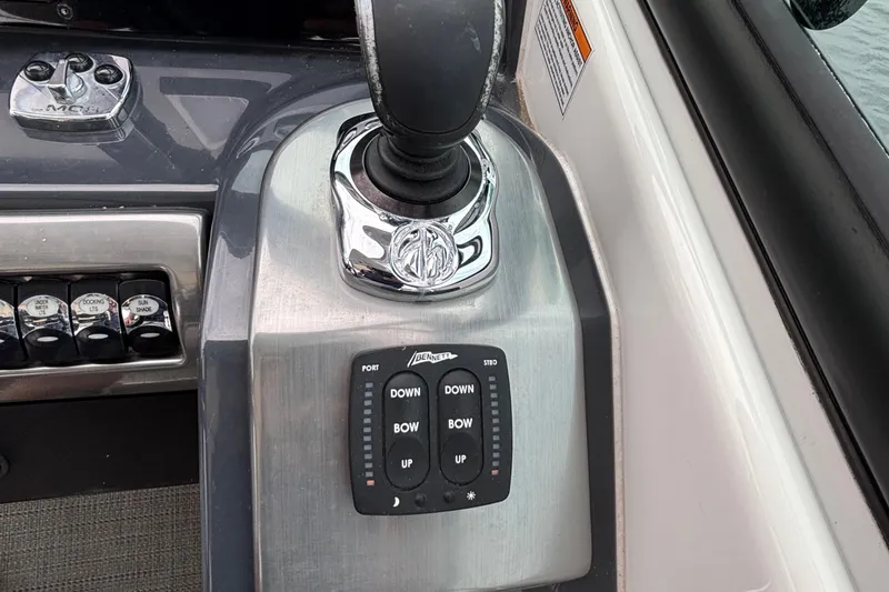 Slide: The Image of Control panel of 2020 Formula 350 Crossover Bowrider with trim tab switches. - 44