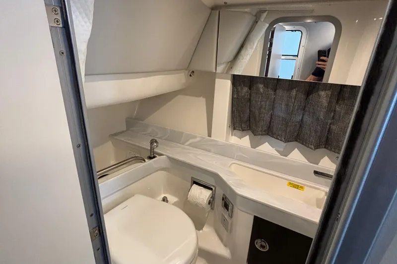 Slide: The Image of 2020 Formula 350 Crossover Bowrider bathroom interior with modern fixtures and compact design. - 48