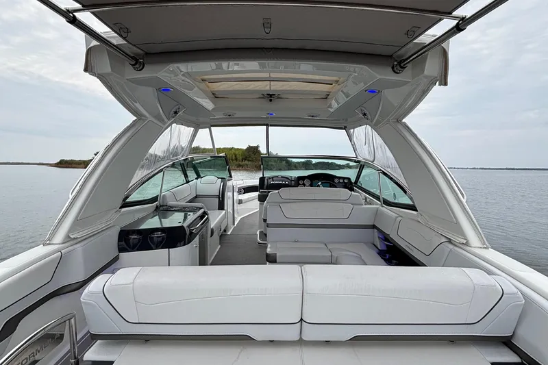 Slide: The Image of 2020 Formula 350 Crossover Bowrider interior with luxurious seating and modern design on a calm lake. - 55