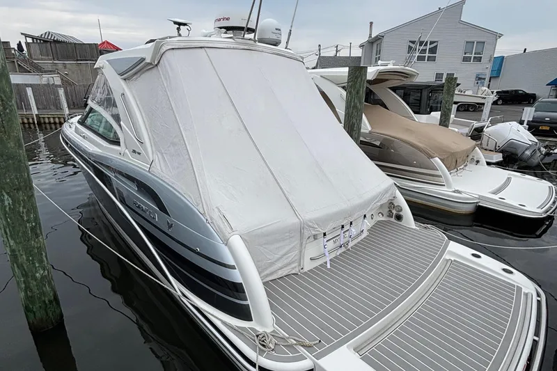 Slide: The Image of 2020 Formula 350 Crossover Bowrider docked with protective cover in marina. - 59