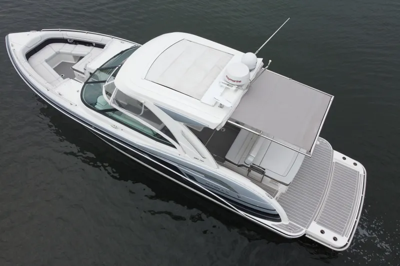 Slide: The Image of 2020 Formula 350 Crossover Bowrider on water, aerial view, sleek design, spacious seating. - 9