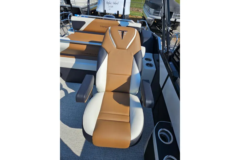 Slide: The Image of Luxurious seating on 2026 Trifecta 23 ULESS boat, featuring brown and white upholstery. - 16