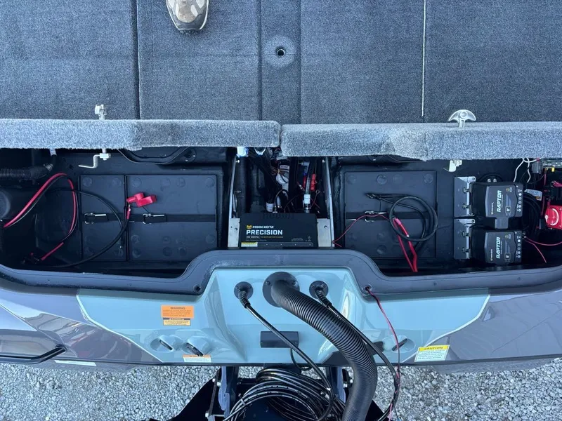 Slide: The Image of Battery compartment of a 2026 Skeeter ZXE20 boat. - 12