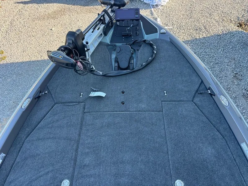 Slide: The Image of Skeeter ZXE20 2026 boat with gray carpet and control console. - 4