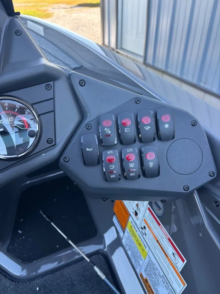 Slide: The Image of Dashboard of a 2026 Skeeter ZXE20 with control switches. - 7