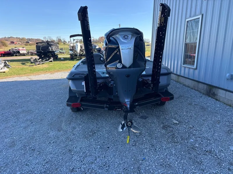 Slide: The Image of Skeeter ZXE20 2026 boat parked on gravel lot. - 9