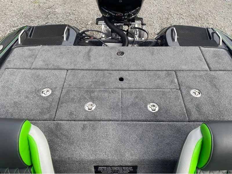 Slide: The Image of Phoenix Pro Series 818 boat deck 2026 with gray carpet and green accents. - 9