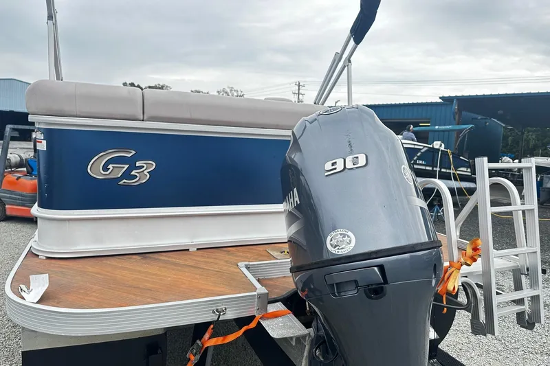 Slide: The Image of 2018 Yamaha Suncatcher G3 Pontoon with 90 HP engine, docked outdoors. - 11