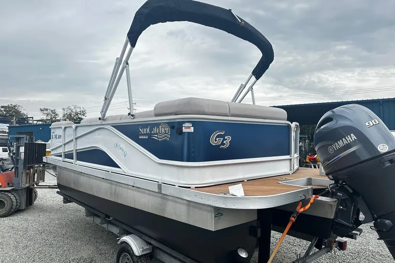 Slide: The Image of 2018 Yamaha Suncatcher G3 Pontoon boat with Yamaha 90 engine on trailer. - 2