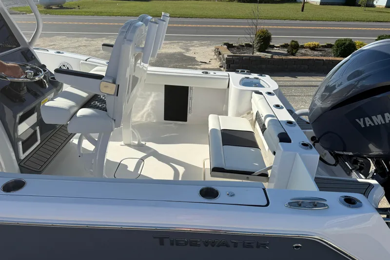 Slide: The Image of 2026 Tidewater 232 CC Adventure boat interior with Yamaha engine, featuring seating and steering console. - 16
