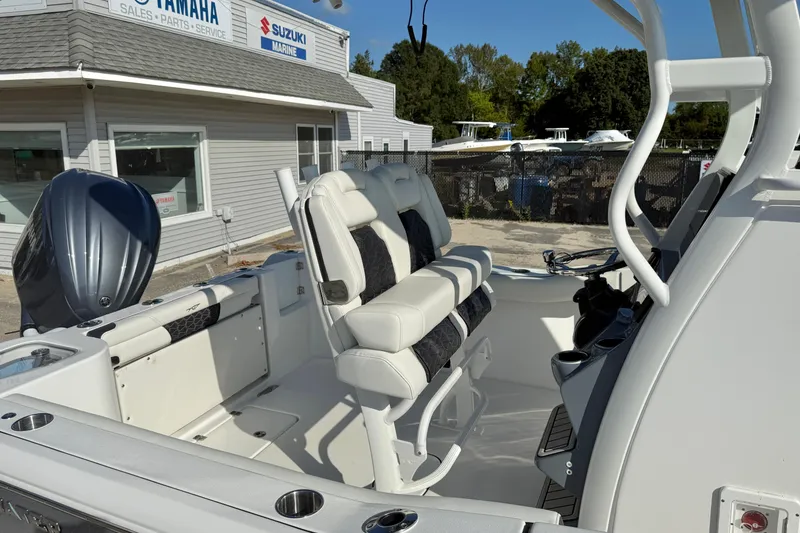 Slide: The Image of 2026 Tidewater 232 CC Adventure boat interior with Yamaha engine at dealership. - 18