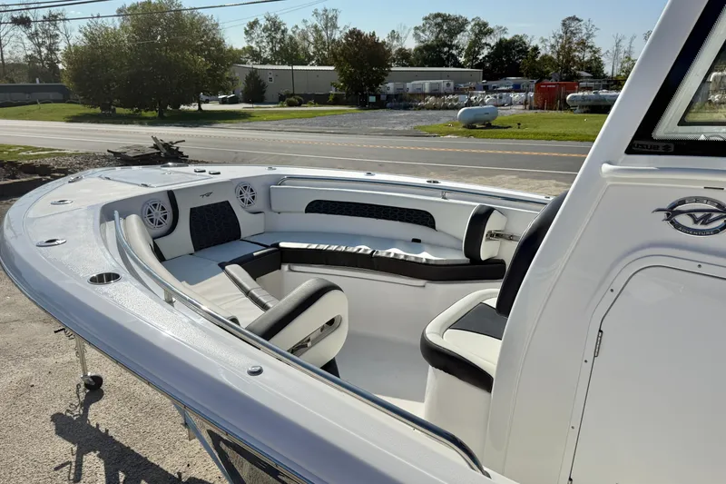 Slide: The Image of 2026 Tidewater 232 CC Adventure boat with sleek seating and modern design. - 19