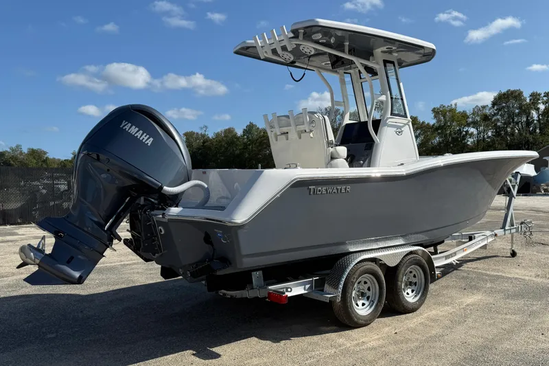 Slide: The Image of 2026 Tidewater 232 CC Adventure boat on trailer with Yamaha engine, parked outdoors. - 5
