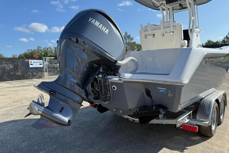 Slide: The Image of 2026 Tidewater 232 CC Adventure boat with Yamaha outboard motor on trailer. - 6