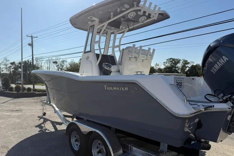 Slide: The Image of 2026 Tidewater 232 CC Adventure boat on trailer, featuring Yamaha engine, parked outdoors. - 8