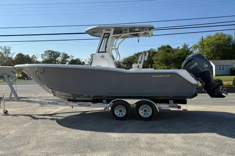 Slide: The Image of 2026 Tidewater 232 CC Adventure boat on trailer, side view, with Yamaha outboard motor. - 9