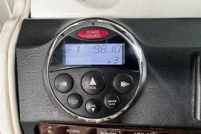 Slide: The Image of Control panel of a 2007 Sea Ray 270 SLX boat, displaying FM radio frequency. - 16