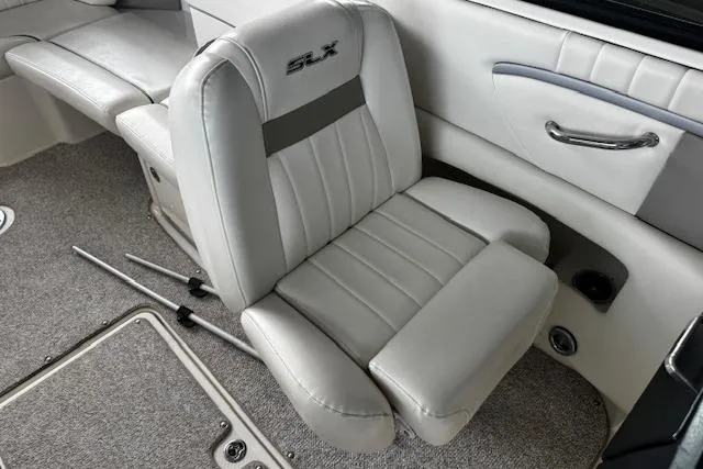 Slide: The Image of 2007 Sea Ray 270 SLX interior with plush gray seating and carpeted flooring. - 20