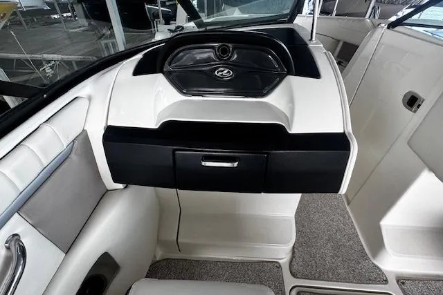 Slide: The Image of 2007 Sea Ray 270 SLX boat interior, featuring sleek dashboard and seating area. - 21