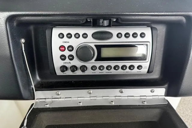 Slide: The Image of 2007 Sea Ray 270 SLX boat stereo system with control panel and display. - 23