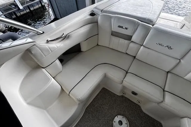 Slide: The Image of 2007 Sea Ray 270 SLX boat interior with white leather seating and elegant design. - 26